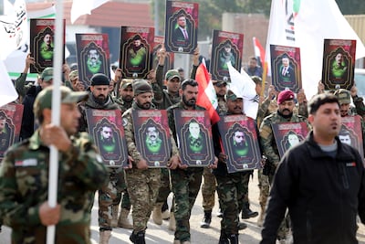 Members of the Popular Mobilisation Forces at a funeral in Baghdad. EPA