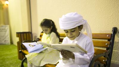 Abdullah, 4, and his sister Khadija Al Khouri, 6, won books from The National’s reading contest. Christopher Pike / The National