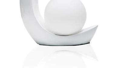 A crescent-shaped table from Royal Furniture. Courtesy Royal Furniture