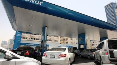 Long lines form outside the Adnoc station near King Faisal Road in Sharjah as petrol stations in the emirate face shortages. Pawan Singh / The National