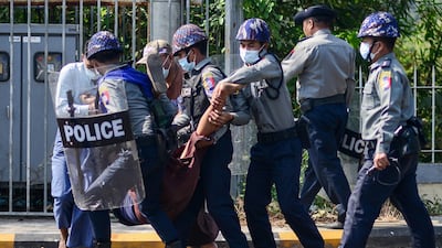 Police arrest a protester during a demonstration against the military coup in Mawlamyine. AFP