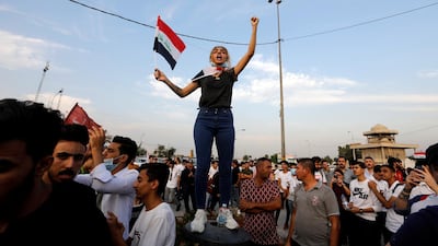A woman demonstrator chants slogans during a protest over corruption, lack of jobs, and poor services, in Baghdad, Iraq. Reuters