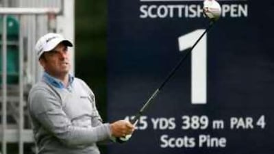 Paul McGinley tees off on the first hole at the start of his first round at the Scottish Open.