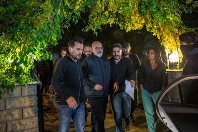 Journalist and writer Ahmet Altan walks with Turkish police as he is rearrested. AFP.