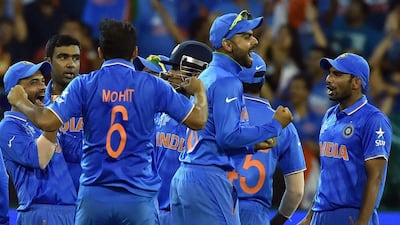 India celebrate the dismissal of South Africa batsman David Miller en route to a 130 run victory over their Pool B rivals. Saeed Khan / AFP