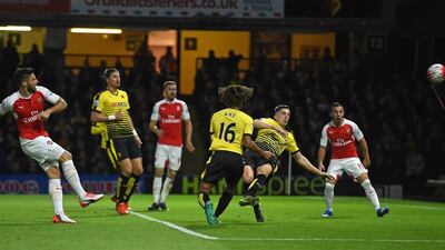 Olivier Giroud of Arsenal shoots and scores their second goal on Saturday against Watford at Vicarage Road. Paul Ellis / AFP