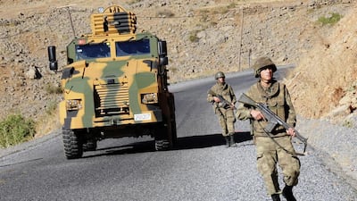 Turkish soldiers patrol a road near Cukurca in the Hakkari province, southeastern Turkey, near the Turkish-Iraqi border on October 22, 2011. Reuters