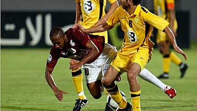 Al Wahda’s Ismail Matar, left, fights for the ball against Al Wasl’s Ali Mahmoud.
