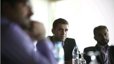 Dan Stuart, the founder of GoNabit, speaks to members of the Entrepeneur's Organisation. Lee Hoagland / The National