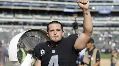 Oakland Raiders quarterback Derek Carr shown celebrating after the team's NFL win over the Baltimore Ravens last Sunday. Ben Margot / AP / September 20, 2015