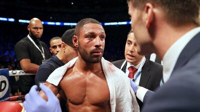 Kell Brook looks on in defeat to Gennady Golovkin after his corner threw in the towel in the fifth round. The British boxer had suffered a series of heavy blows from his opponent. Richard Heathcote / Getty Images