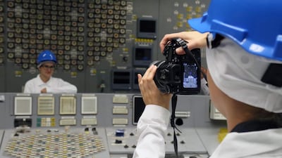 People pose for a picture at the monitoring room.