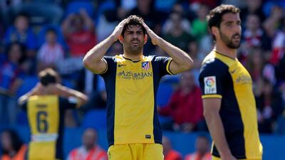 Diego Costa, centre, and his Atletico Madrid cannot believe the opportunity lost to draw the Primera Liga title closer in losing 2-0 to host Levante at Ciutat de Valencia Stadium on May 4, 2014 in Valencia, Spain. Gonzalo Arroyo Moreno / Getty Images