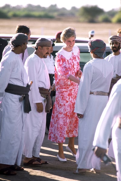 The Princess of Wales arriving for a polo match in Muscat, Oman, November 1986. She is wearing a dress by Paul Costello. Getty Images