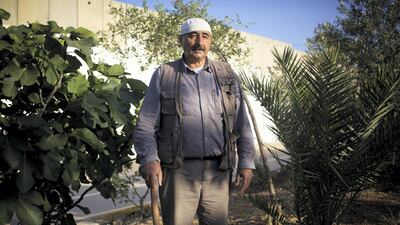 Hani Amir Mas’ha, West Bank, 2016: "My house and garden are surrounded by the wall they built in 2003. They uprooted my trees with bulldozers and, honestly, it felt like they were uprooting me. They destroyed the nursery where I grew plants to sell. Settlers and soldiers often come in the dead of night and threaten us, throw stones and trample all over my land. Diplomats stepped in so the situation is a little bit better now, but you never know. They want this land, but this land is mine. I’m not angry about their hatred towards us, their cruelty or violence. But I am angry that they have treated nature so badly. I don’t know if I’m right in staying here, but I do know that this garden belongs to me." Photo: Lalage Snow