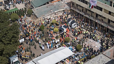 Volunteers and rescue workers search for children trapped inside the Enrique Rebsamen school, collapsed by a 7.1 earthquake in southern Mexico City. Miguel Tovar / AP Photo