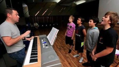 Cast members of London's West End theatre company Popular Productions rehearse the musical Oliver! in Dubai.