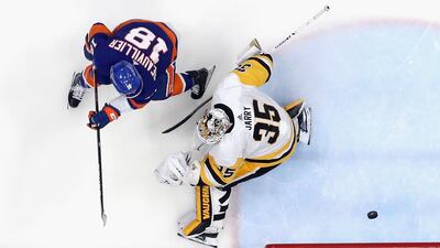 New York Islanders' Anthony Beauvillierf finishes past Tristan Jarry of the Pittsburgh Penguins in the Stanley Cup playoffs at the Nassau Coliseum on May 26. The Islanders won 5-3 to seal the series 4-2 and move on to face Boston. AFP