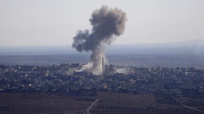 Smoke rises from the Syrian village of Jubata Al Khashab after it was bombed by a Syrian fighter jet on September 23, 2014, moments before the Syrian aircraft was shot down by the Israeli military over the Golan Heights. Jalaa Marey/AFP Photo