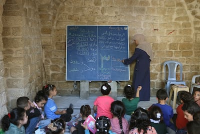 Palestinian children in class at Al Kamaliya Al Othmanya school in Gaza city's Old Town. AFP