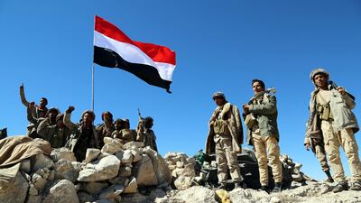 Yemeni fighters, loyal to the Saudi-backed Yemeni government, hold position during an offensive against Houthi rebels positions in the Nihem region, east of Sana'a. Soliman Al Nowab / EPA
