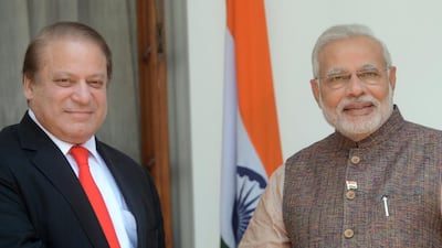 India’s newly sworn-in prime minister Narendra Modi, right, shakes hands with the Pakistani prime minister Nawaz Sharif during their meeting in New Delhi on May 27, 2014. Raveendran / AFP