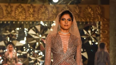 Traditional Indianwear aside, Falguni & Shane Peacock also showed off some Indo-Western looks, complete with lace, frills and ruffles. AFP