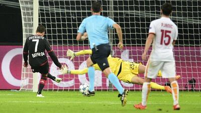 Bayer Leverkusen’s Javier Hernandez scores his side’s second goal during their Champions League contest with AS Roma on Tuesday. Sebastian Konopka / AP