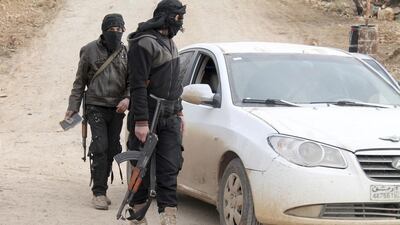 Members of Islamist Syrian rebel group Jabhat Al Nusra man a checkpoint on the southern border crossing between Syria and Jordan. Ammar Khassawneh / Reuters