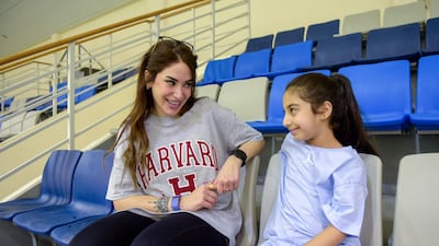 Reyadh talks to her daughter Huma, 7