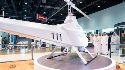 Sheikh Mohamed bin Zayed visits the Abu Dhabi Autonomous systems Investment Co stand, which built the UAE's first locally-made drone, at Umex. Seen with Faisal Al Bannai.