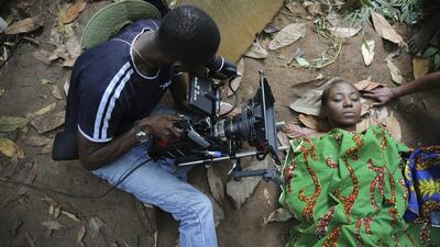 A cameraman films a scene for the movie ‘October 1’, a police thriller directed by Kunle Afolayan, in Ilaramokin village in southwest Nigeria.