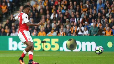 Alex Iwobi of Arsenal hits a shot which leads to the first goal by Alexis Sanchez. Alex Morton / Getty Images