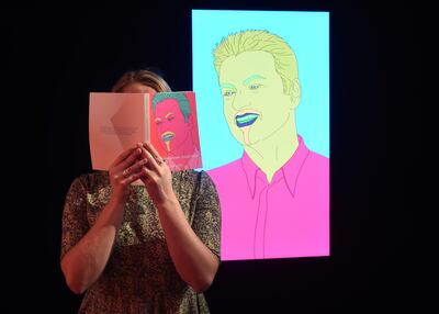 A Christie's staff member poses with commissioned portrait by Michael Craig-Martin. Getty Images