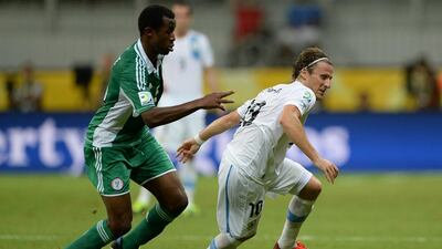 Forlan, right, and Nigeria’s defender Efe Ambrose during their Fifa Confederations Cup Brazil 2013 Group B football match, at the Fonte Nova Arena in Salvador on June 20, 2013. Eitan Abramovich / AFPA