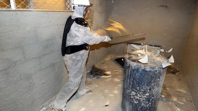 Smashing a glass off of a barrel in The Smash Room. Chris Whiteoak / The National