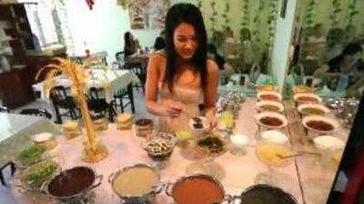 Diners can create their own condiments at the sauce buffet at Qian Zhou Hotpot.