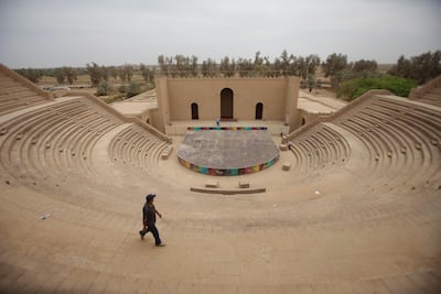 A man walks in front of an amphitheatre in Babylon. AP Photo
