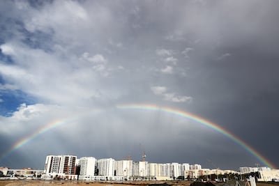 A rainbow arches over Dubai's skyline after heavy rain. Pawan Singh / The National