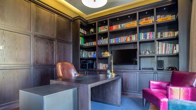 Dark wood panelling is offset by brighter upholstery. Courtesy LuxuryProperty.com