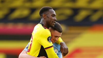 Manchester City's Phil Foden and Watford's Danny Welbeck after the match. Reuters