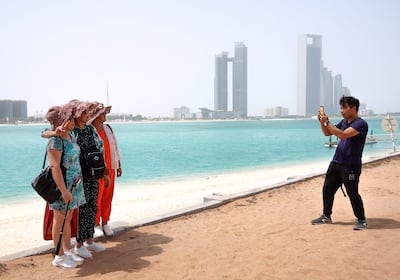 Tourists at the Heritage Village, Corniche, Abu Dhabi. Victor Besa / The National