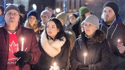 People attend a vigil for victims of a shooting at a Quebec City mosque, at the Grand Parade in Halifax, Nova Scotia, on January 30, 2017. AP / Andrew Vaughan / The Canadian Press