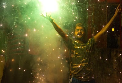 A Bharatiya Janata Party (BJP) supporter celebrates at the party office in Gauhati, India, Thursday, May 23, 2019. AP