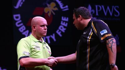 Michael van Gerwen, left, shakes hands with Adrian Lewis after their semi-final. Francois Nel / Getty