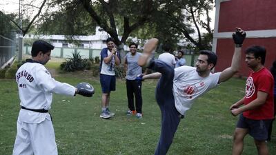 Doctors from the All India Institute of Medical Sciences (AIIMS) learning taekwondo at a park in the hospital campus in New Delhi, India on May 15, 2017. Mustafa Quraishi for The National