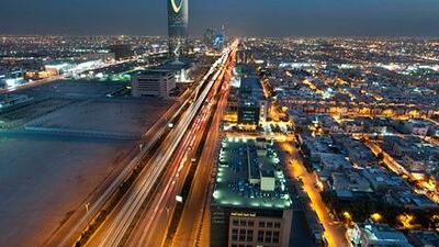 Saudi Arabia has 23 per cent less outstanding sovereign debt than neighbouring Qatar, whose economy just over a quarter the size. Above, the kingdom's capital Riyadh at night. Waseem Obaidi / Bloomberg News