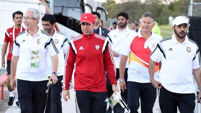 UAE coach Mahdi Ali, centre, leads his staff to training.