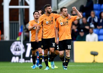 Wolverhampton Wanderers' Diogo Jota, right, celebrates scoring an injury-time equaliser at Crystal Palace on Sunday. PA