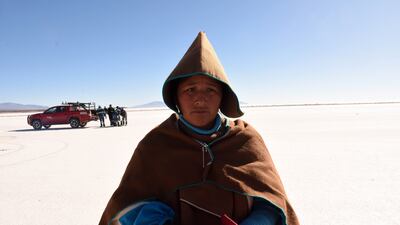 An indigenous woman from the Uru Chipaya people poses in a salt flat, where Bolivia confirmed a lithium reserve. EPA